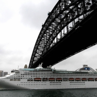 Cruise Ship Under Bridge