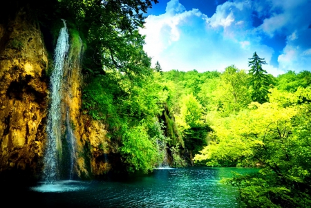 Waterfall in deep forest - pretty, calm, quiet, sunny, forest, deep, exotic, lake, nice, sky, clouds, falling, greenery, sunlight, beautiful, lovely, stones, fall, river, nature, waterfall, rays, green, serenity, rocks, shine