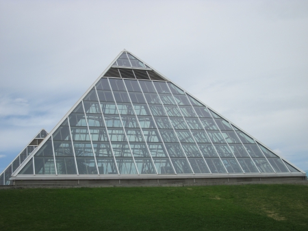 A Glass pyramids as a botanical garden - glass, modern, photography, pyramids, green, grass