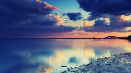 darkening clouds over calm bay - reflection, clouds, sunset, bridge, bay