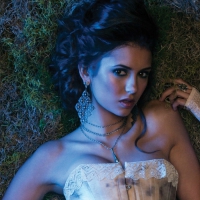 Nina Dobrev as Elena