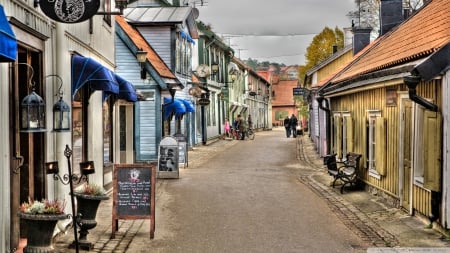 stores on a wonderful side street - street, stores, signs, houses