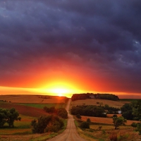 amazing sunrise at the end of a country road