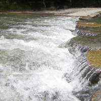 Across the rapidly flowing streams