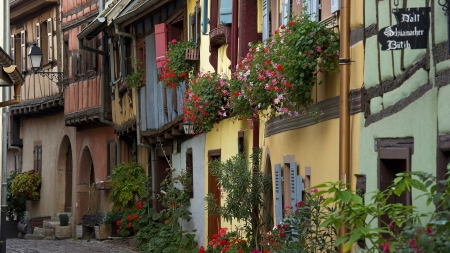 colorful facades of row houses - flowers, doors, cobblstones, wndows, facades, houses