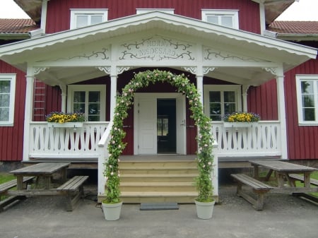 Wedding Arch - arch, porch, roses, pots, pink, rustic site, flowers