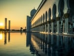 the grand mosque in abu dhabi at sunset