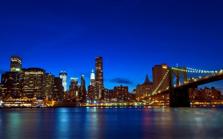 Manhattan - bridges, water, blue, beautiful, manhattan, night, architecture, usa, colorful, lights, skyscrapers, new york, sky