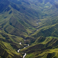 snake river in a narrow green valley