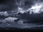 storm clouds forming over a rural village