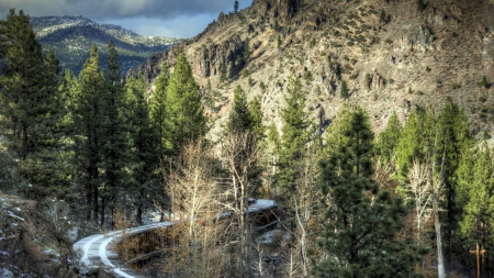 snow covered train tracks in beautiful landscape - snow, forest, mountains, railroad tracks