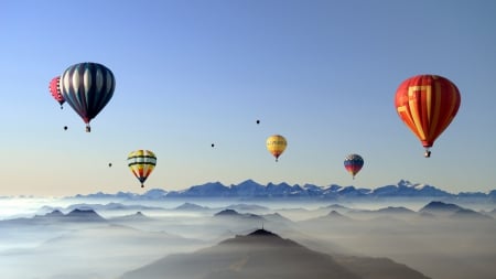 colorful hot air balloons above the clouds - balloons, clouds, peaks, mountains