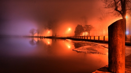 orange light in a lakeside park at night - lake, lamps, light, orange, posts, shore, mist