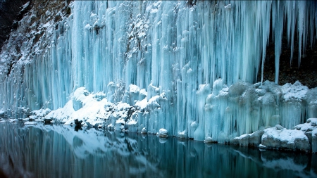 icicles down a cliff into a pond - winter, pond, cliff, reflection, icicles