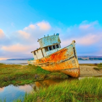 beached ship wreck at end of the bay