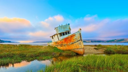 beached ship wreck at end of the bay - wreck, clouds, shore, bay, grass, boat