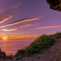 magnificent sunset through a coastal cave