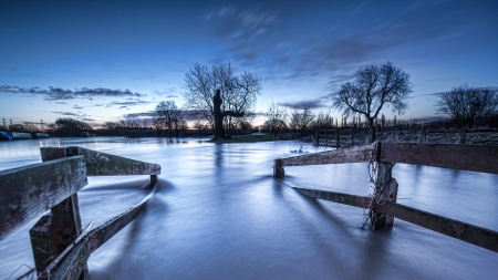 fenced ramp into a river at dusk - river, trees, fences, ramp, dusk