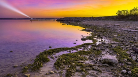 beacon under a colorful sunset at the seashore - beacon, shore, sunset, sea, colors