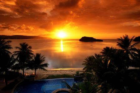 SUNRISE ABOVE THE OCEAN - rock, palm trees, pool, sunrise