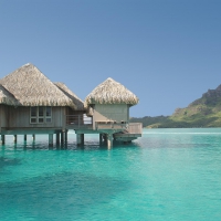 St Regis Water Villa Bungalow over clear Blue Lagoon Bora Bora French Polynesia