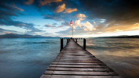 pier on a beautiful swiss lake - pier, lake, flag, clouds, mountains