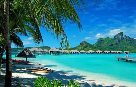 St Regis Resort Bora Bora beach blue lagoon and water villas