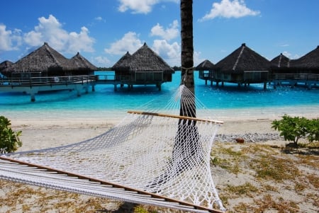 Water Villas on Blue Lagoon Bora Bora Paradise island French Polynesia - hut, beach, hammock, paradise, water, polynesian, bungalows, hotel, villa, polynesia, bora bora, atoll, lagoon, resort, sand, zen, relax, bungalow, ocean, tahitian, islands, tropical, huts, exotic, luxury, blue, villas, island, spa, sea, retreat, tahiti