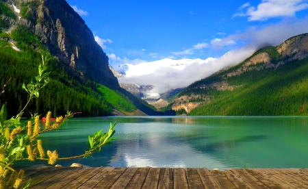 Lake Louise-Alberta, Canada - pretty, calm, quiet, reflection, crystal, mountain, flowers, shore, Canada, lake, nice, emerald, sky, clouds, beautiful, Loiuse, lovely, dock, stones, Alberta, pier, nature, clear, serenity, rocks