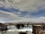 photographer shooting a gorgeous waterfall