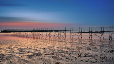 pier on a beach at low tide - clouds, beach, low tide, pier, sea