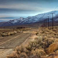 broken highway along a mountain range