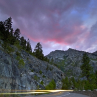 lights in long exposure on highway at dusk