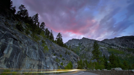 lights in long exposure on highway at dusk - highway, lights, cliff, dusk, log exposure, mountains