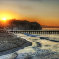 superb sunset over a seaside pier