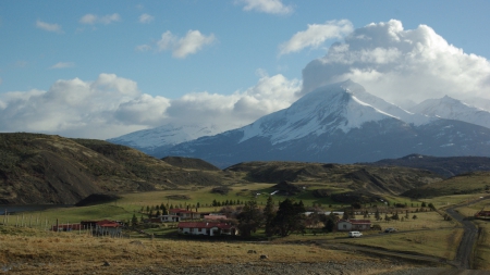 lovely town under majestic mountains in patagonia - clouds, town, snow, grass, mountains