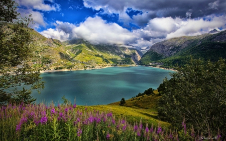 Lake view - nice, sky, slope, rocks, view, quiet, reflection, calmness, clouds, emerald, cliffs, lake, mountain, shore, lovely, serenity, nature, blue, tranquil, beautiful, flowers