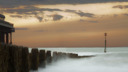 misty sea enveloping a wharf at sundown - wharf, sundown, pylons, mist, sea