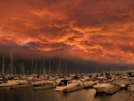 fiery sky over boat marina