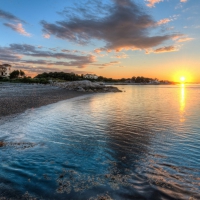 sunrise over mansions on a beach hdr