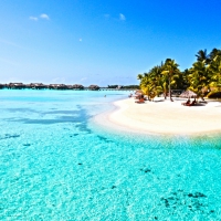 Beautiful Perfect Clear Blue Lagoon Ocean and white sand paradise beach on Tropical Island Bora Bora Tahiti Polynesia