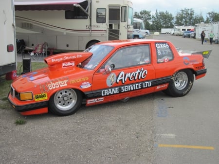 Different world on the raceway - orange, tires, black, photography