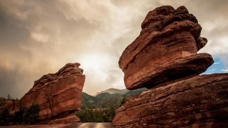 road through a wonderful rock formation - road, clouds, formation, rocks