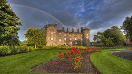 wonderful rainbow over in irish castle - rainbow, lawn, castle, clouds, flowers