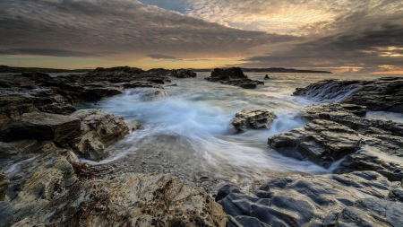 crashing waves on a rocky seashore - shore, sundown, waves, sea, rocks