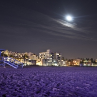 moon over santa monica beach in purple