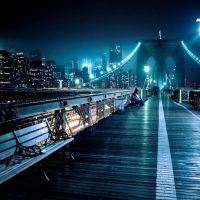 walkway on top of brooklyn bridge at night