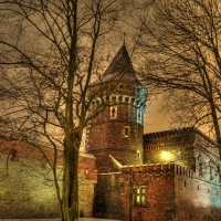 a fortress in poland on a winter night