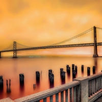 fabulous bay bridge in orange sky hdr