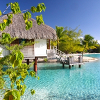 Water Villa Bungalow overlooking clear aqua lagoon ocean Bora Bora Island